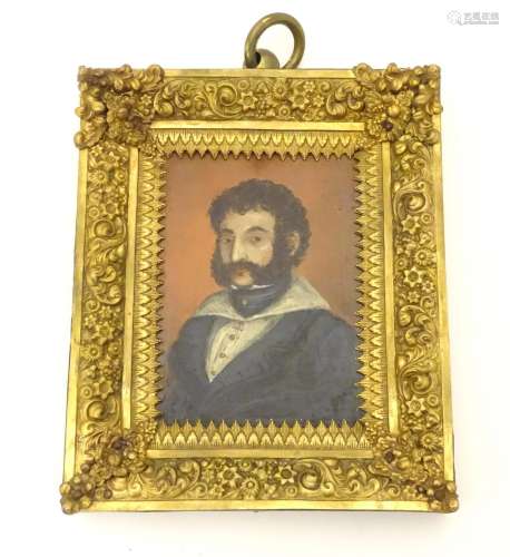 A 19thC oil on board portrait miniature depicting a gentleman wearing a blue jacket, a wide collared