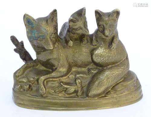 A Continental cast sculpture depicting a fox and two fox cubs with traces of gilt finish. Approx.