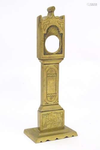 A late 19th / early 20thC brass pocket watch holder modelled as a miniature long case clock with