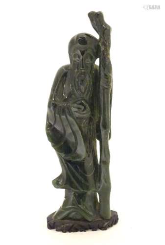 A Chinese carved hardstone jade sage figure, possibly Shou-Hing, the Chinese god of longevity as a