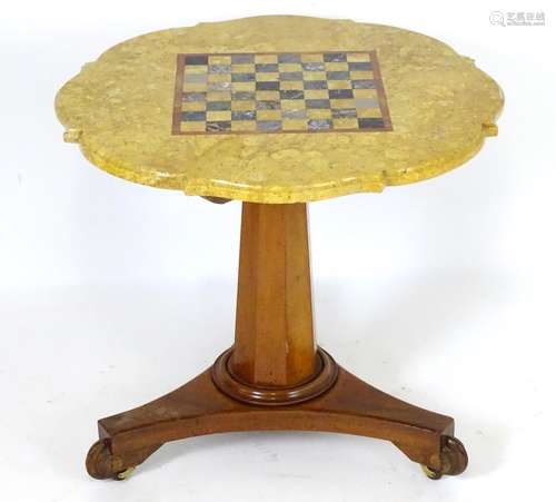 A Victorian marble top table with a shaped top and games board to centre, the bottom having a