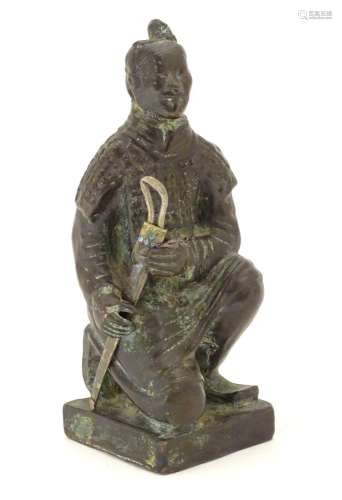 A 20thC model of a kneeling samurai. Approx. 5 1/4