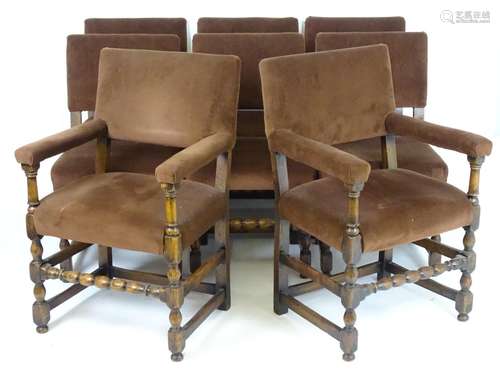 A set of eight early 20thC oak Jacobean style dining chairs with block and turned supports and