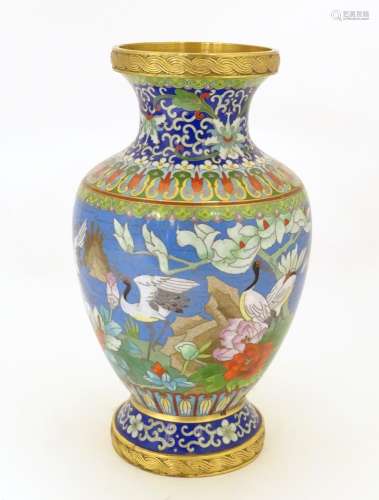 A 20thC Chinese cloisonne vase of baluster form, decorated with crane birds, flowers to include