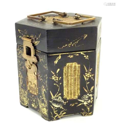 A Chinese lacquer tea caddy of hexagonal form with a hinged lid, scrolling floral and foliate detail