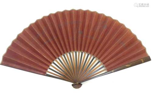 A 19thC Japanese lacquer fan with 23 sticks, the paper decorated with stylised birds in flight.