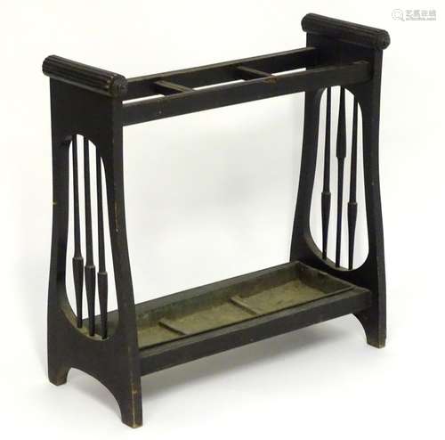 A 19thC Aesthetic movement stick stand with a three sectional centre, turned tapering spindles to