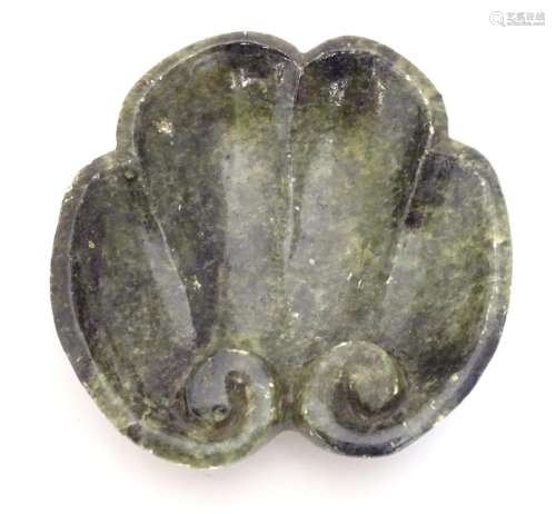 A Chinese carved soapstone dish formed as a stylised leaf with scroll detail. Approx. 4 3/4