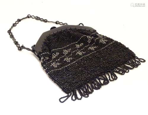 A 20thC bead work bag /purse with banded detail. Approx. 7