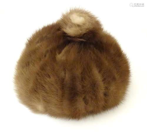 A vintage fur hat Please Note - we do not make reference to the condition of lots within
