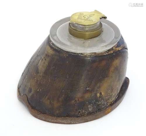 An inkwell formed from a horse hoof and having a brass lid to inkwell engraved with Masonic