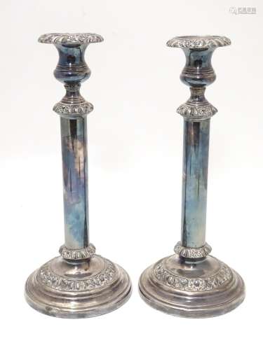 A pair of silver plate candlesticks Approx. 12