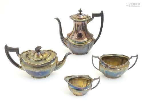 A 4 piece silver plate teaset comprising cream jug, sugar, teapot and hot water pot. The tallest