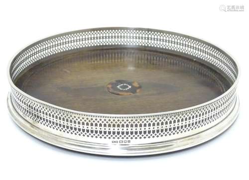 A silver tray with with turned wooden base Hallmarked London 1992 maker Whitehill Silver & Plate Co.
