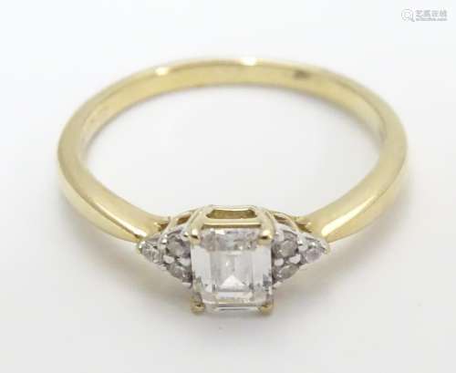 A 9ct gold ring set with cubic zirconia. Ring size approx M Please Note - we do not make reference