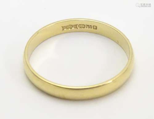 An 18ct gold ring. Approx 1.7g. Ring size approx L 1/2 Please Note - we do not make reference to the