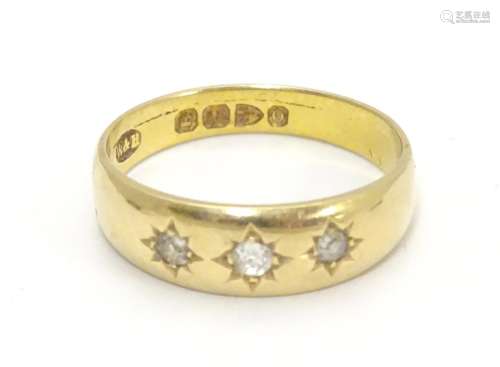 A Victorian 18ct gold diamond ring set with three diamonds. Hallmarked Chester 1897. Ring size
