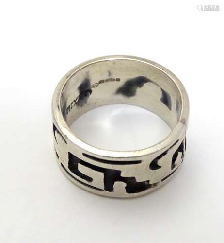 A Mexican silver ring of band form with abstract detail. Ring size approx. O Please Note - we do not