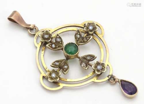 A 9ct gold pendant of Edwardian suffragette manner, set with green violet and white seed pearls. The