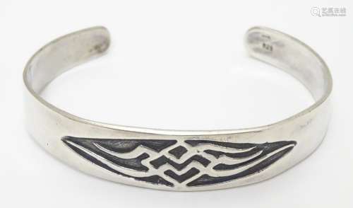 A 925 silver bangle with incised decoration. Bears maker?s mark CAO. Please Note - we do not make