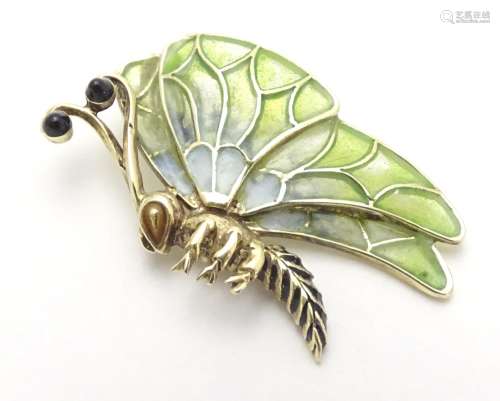 A 14ct gold pendant formed as a butterfly with plique a jour detail to wings. 1 1/2