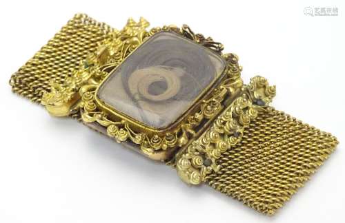 Mourning / Memorial jewellery : A 19thC gilt metal mourning bracelet of cuff form with wide chain