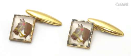 Gilt plated cufflinks with essex crystal style cabochon decoration depicting horse heads. Please