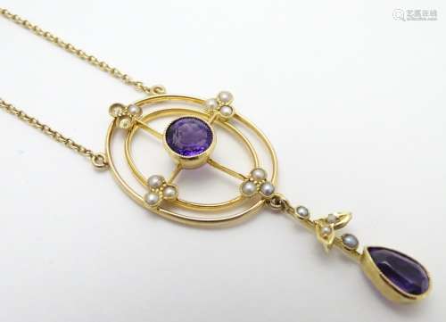 A 15ct gold pendant and chain, the pendant with amethyst and seed pearl decoration. Approx. 19