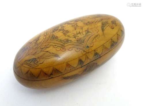 A 19thC Scandinavian treen snuff box of oval form with naive penwork decoration depicting stylised
