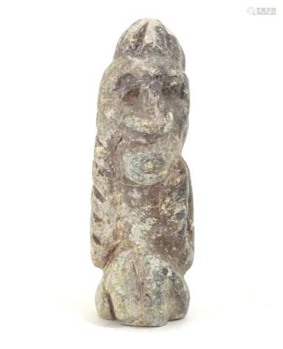 A soapstone carving modelled as a stylised crouching figure. Approx. 5