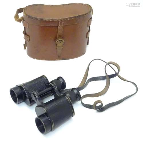 A cased pair of binoculars / Field Glasses by A. Kershaw & Sons, Leeds, stamped 1941,