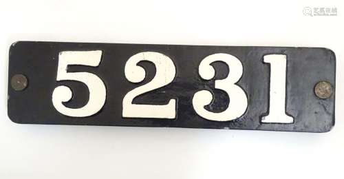 A cast metal and painted number plaque 5231. Approx. 5 3/4