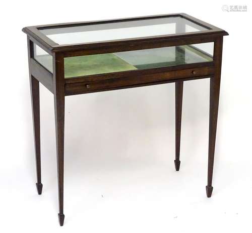 An early / mid 20thC vitrine / display cabinet with a glass lid above a small coin / medal drawer.