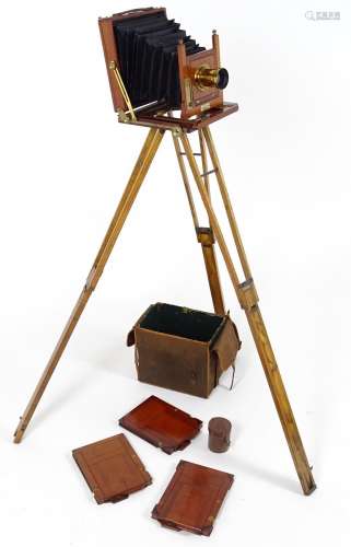 A c1900 plate camera, of mahogany construction, bearing an ivorine plaque inscribed 'The Society -