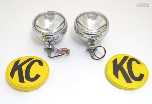 A pair of KC Hilites chromium automotive spotlights with covers, each 6