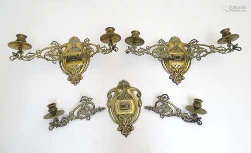 A trio of 19thC brass adjustable double wall sconces, decorated with acanthus fronds and elements of