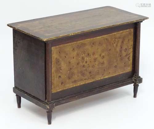 An early 20thC scumbled pine painted box with turned columns to the face and raised on turned