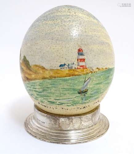 A 20thC hand painted ostrich egg depicting Mouille Point, Table Bay, South Africa, a coastal scene