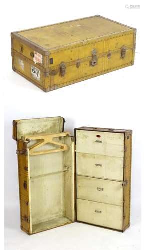 An early 20thC fitted steamer trunk / portmanteau with the case opening to show fitted drawers and