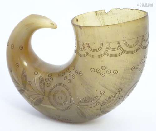 A 19thC rams horn vessel / flask with engraved foliate and roundel decoration. Approx. 4 1/2