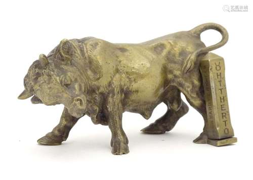 An early 20thC brass model of a charging bull, with a post engraved From Harry Granger, Hitherto,