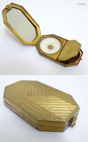 A French Art Deco gilt compact vanity by Houbigant, France, opening to reveal a mirror and two