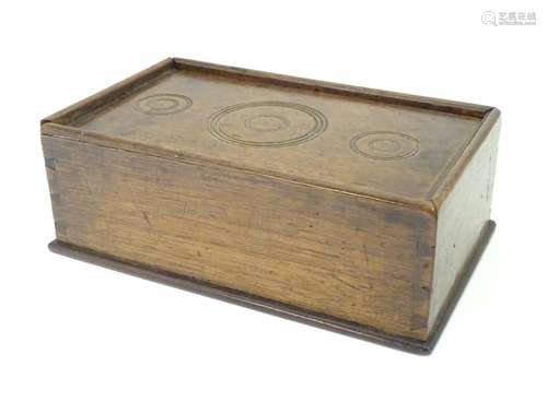 A Georgian spice box, the sliding lid opening to reveal four sections within. The lid decorated with