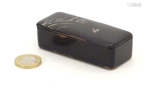 A late 19th / early 20thC papier mache snuff box with inlaid mother of pearl detail depicting