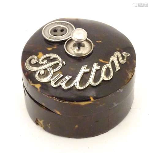 A Victorian turned wooden button box with tortoiseshell veneer of circular form with silver