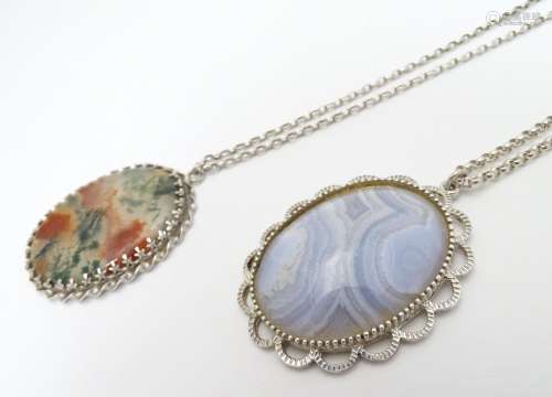 Two silver pendants and chains each set with agate cabochons, one moss agate. Each pendant approx 2