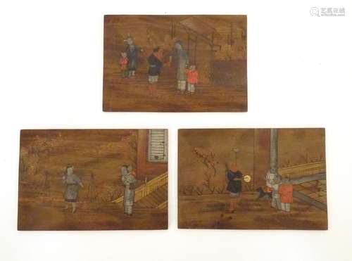 Three Oriental wooden panels with hand painted scenes depicting, a terrace scene with figures and