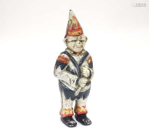 A 21stC cast money box formed as a clown with polychrome decoration. Approx. 5 1/2