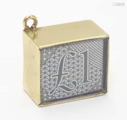 A novelty 9ct gold pendant charm of squared form. Engraved ' In Emergency break glass' and