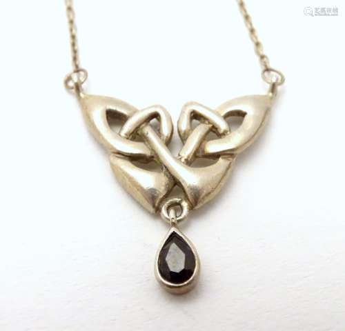 A silver pendant and chain necklace with Celtic style decoration approx 16